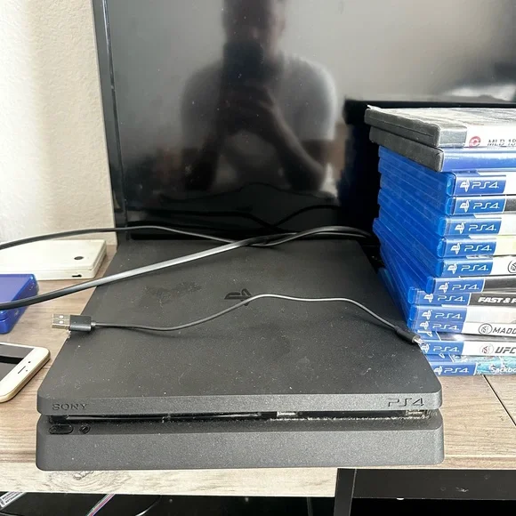 Sony PlayStation 4 Console with Games and 2 controllers - Black